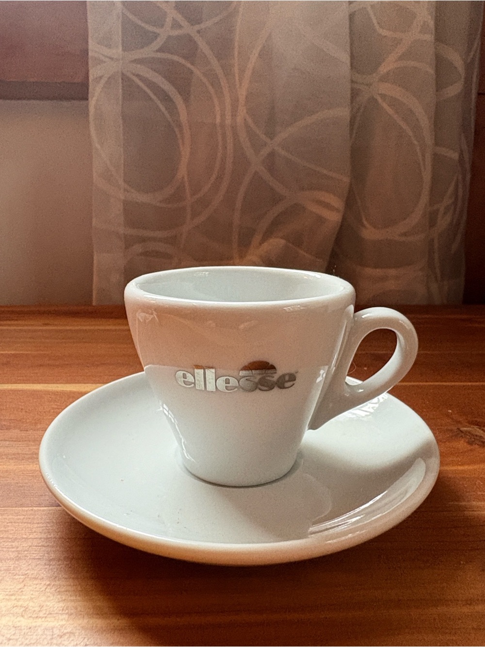 Ellesse Brand White Porcelain Espresso Cup and Saucer with Silver Logo